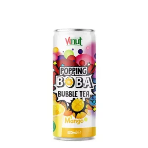 Canette de Vinut Popping Boba Bubble Tea saveur mangue 320 ml avec perles de boba et mangues fraîches sur fond jaune tropical.